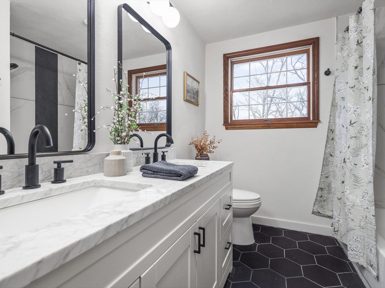 1927 Baintree Road Lake Summerset, IL 61019 - Photo 42 of 71 a bathroom with a double vanity sink toilet and a mirror