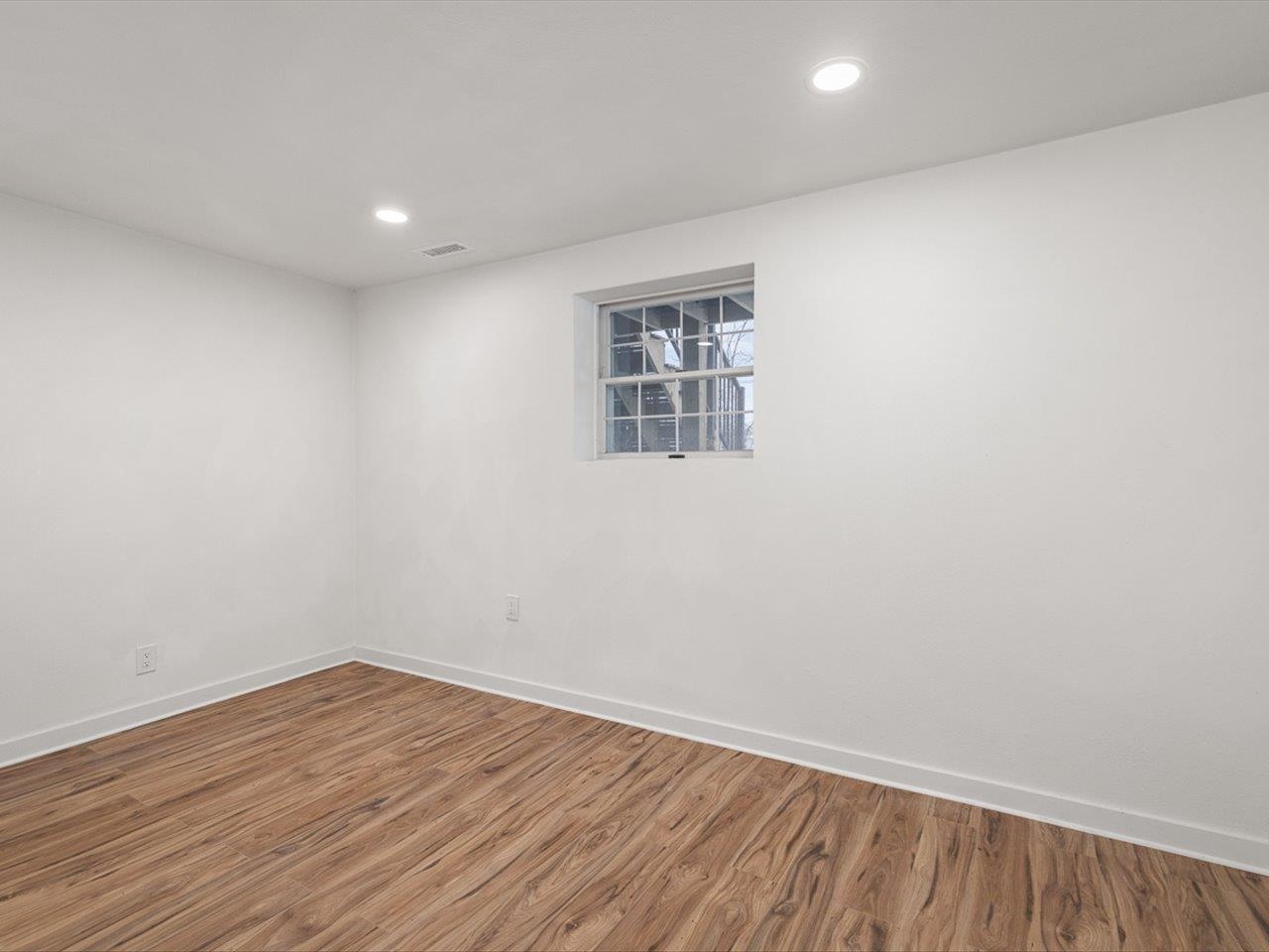 1927 Baintree Road Lake Summerset, IL 61019 - Photo 51 of 71 an empty room with wooden floor and windows