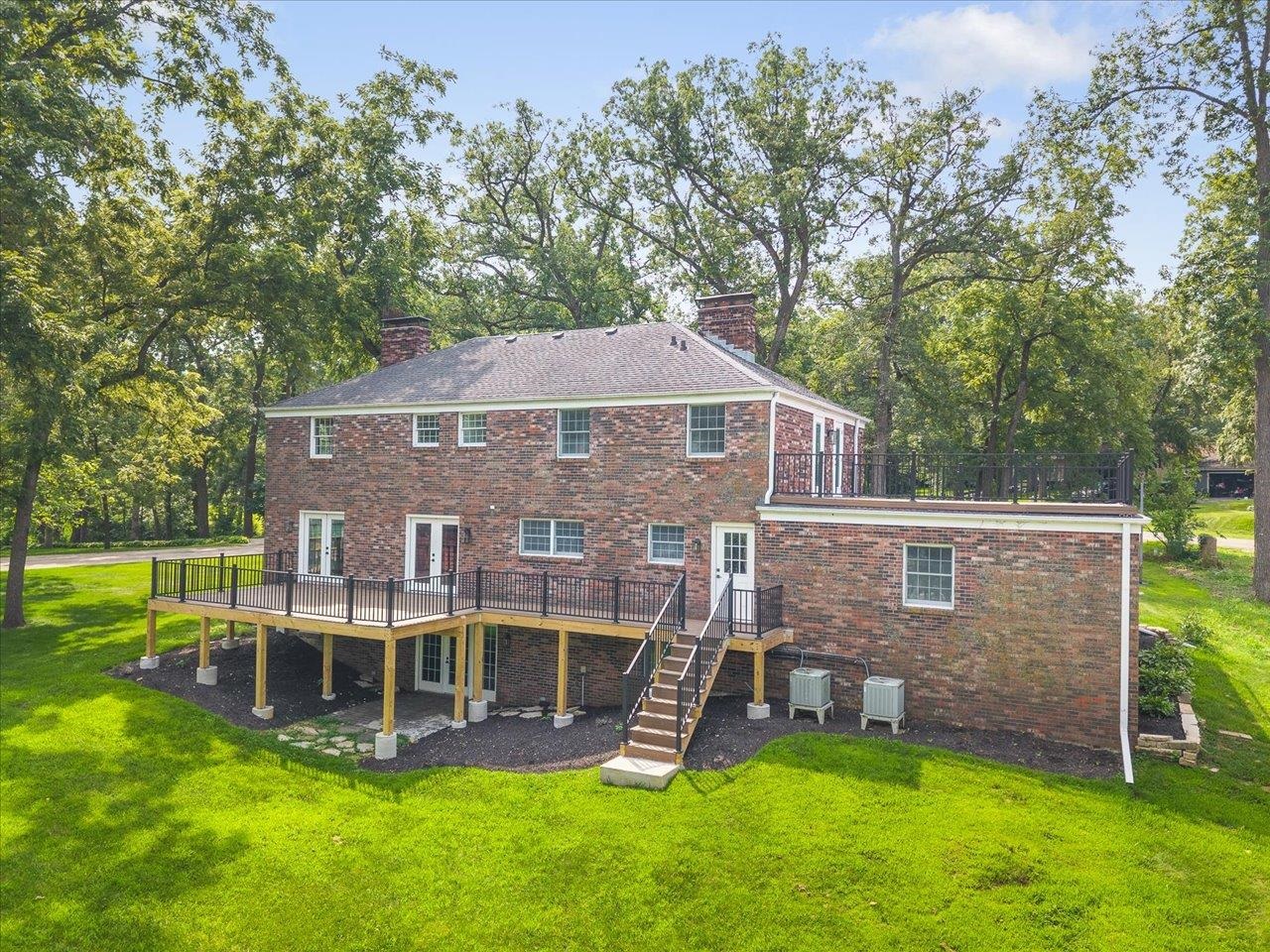 1927 Baintree Road Lake Summerset, IL 61019 - Photo 60 of 71 a view of a house with a backyard and a patio