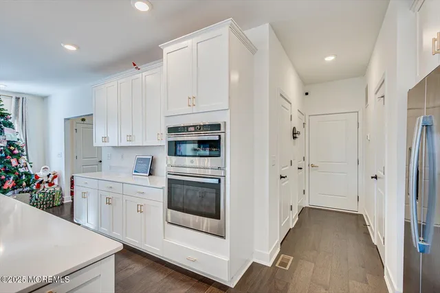 a view of a work space with furniture and wooden floor