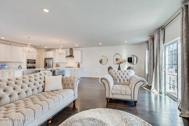 a view of staircase with wooden floor and white walls