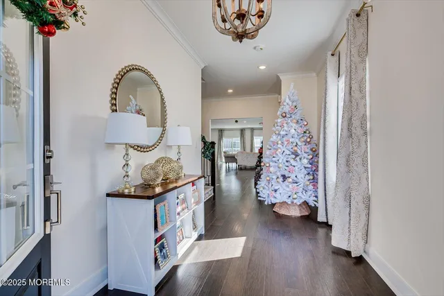 a view of an entryway with wooden floor