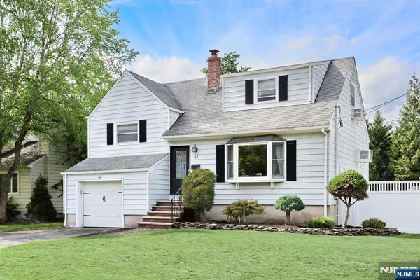 a front view of house with yard