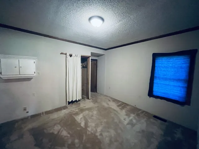 a room with furniture and a window