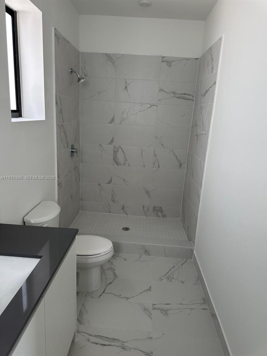 34430 Southwest 190th Avenue Homestead, FL 33034 - Photo 16 of 18 a bathroom with a sink a toilet and shower