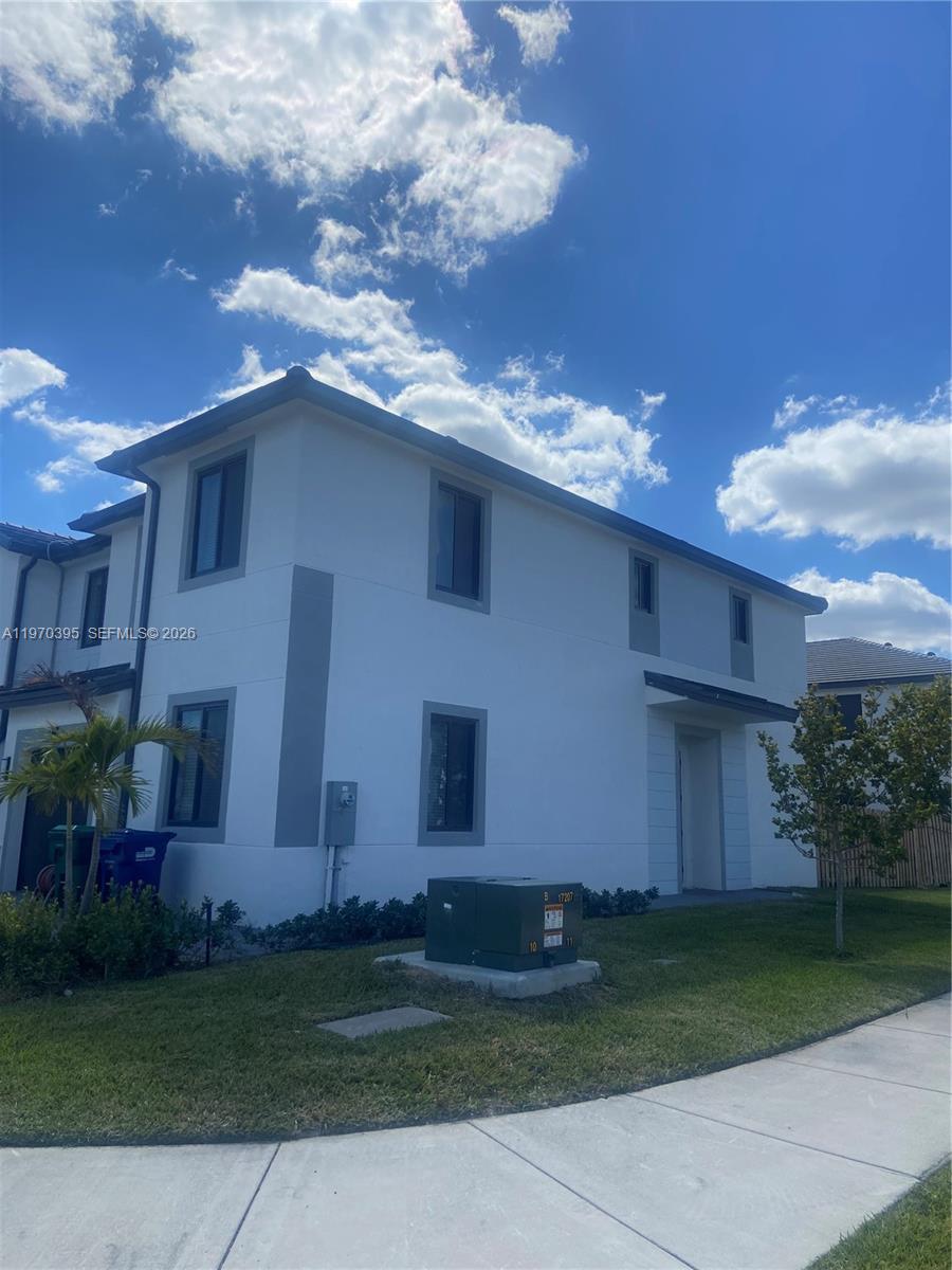 34430 Southwest 190th Avenue Homestead, FL 33034 - Photo 17 of 18 a front view of house with yard and green space