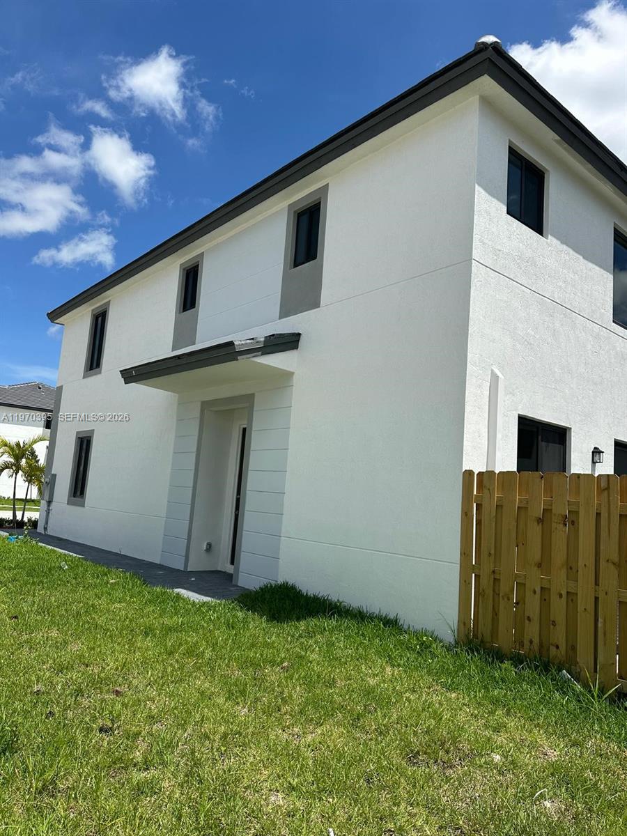 34430 Southwest 190th Avenue Homestead, FL 33034 - Photo 4 of 18 a view of a backyard of the house