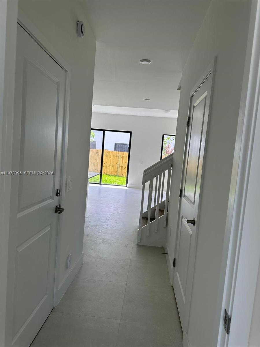 34430 Southwest 190th Avenue Homestead, FL 33034 - Photo 5 of 18 a view of a hallway with front door