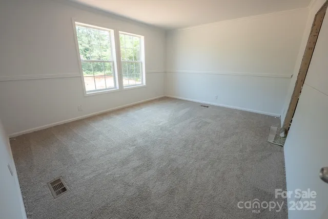a bathroom with a double vanity sink and mirror