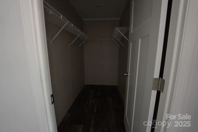 a bed sitting in a room next to a window