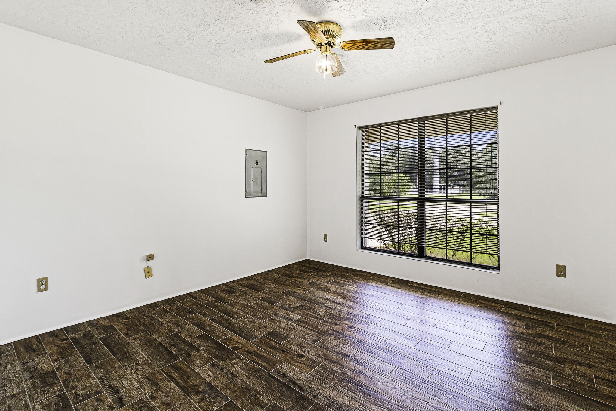 13180 Morgan Drive Splendora, TX 77372 - Photo 15 of 34 an empty room with wooden floor and windows