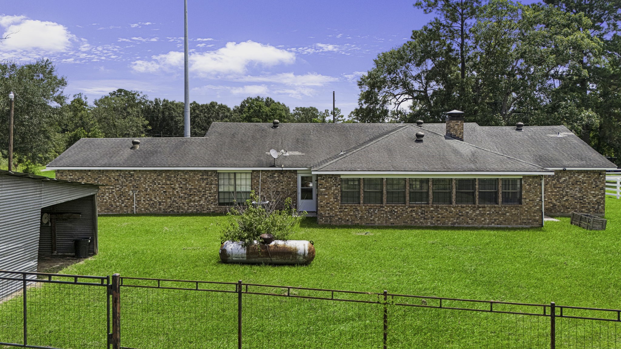 13180 Morgan Drive Splendora, TX 77372 - Photo 23 of 34 a view of a house with a yard