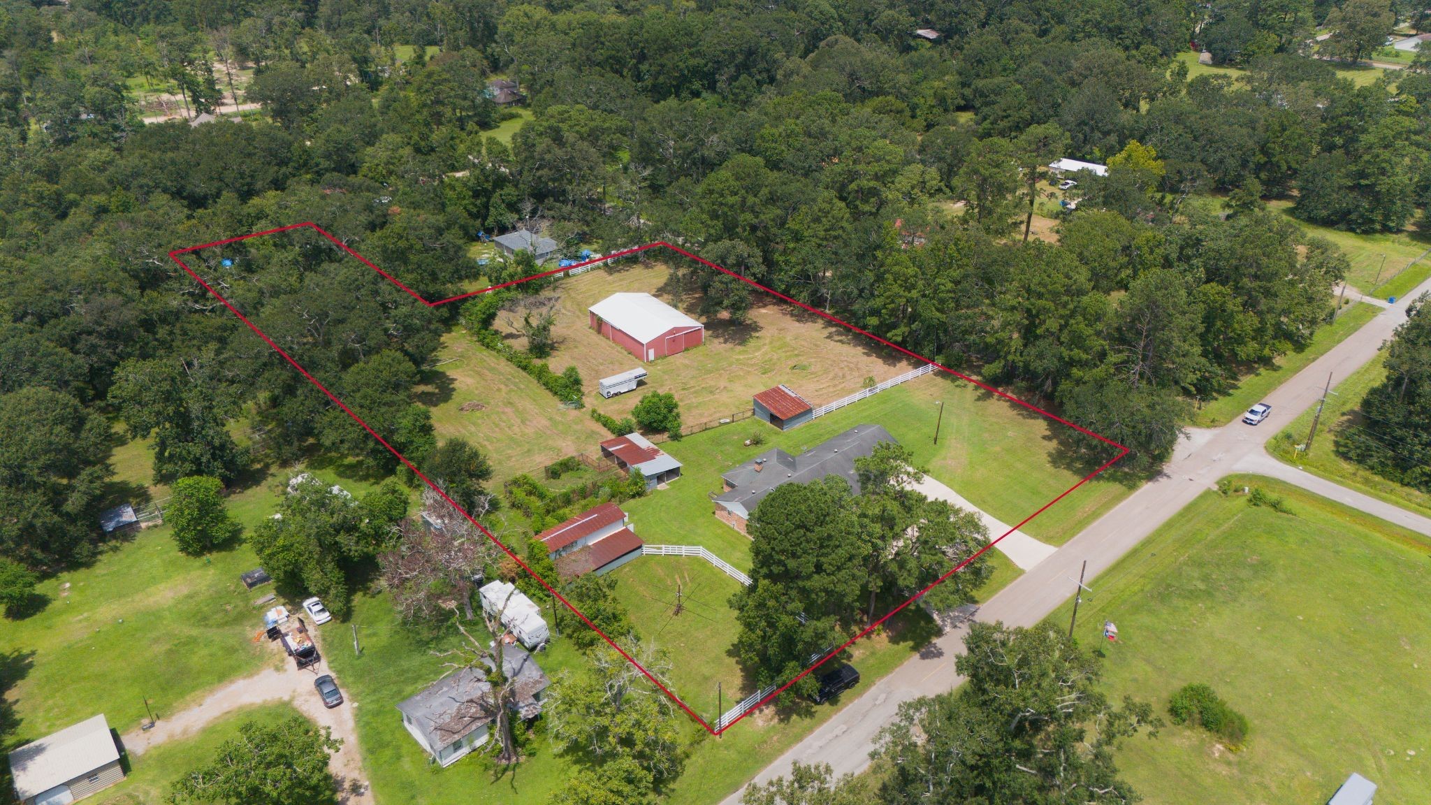 13180 Morgan Drive Splendora, TX 77372 - Photo 28 of 34 an aerial view of a house with a yard
