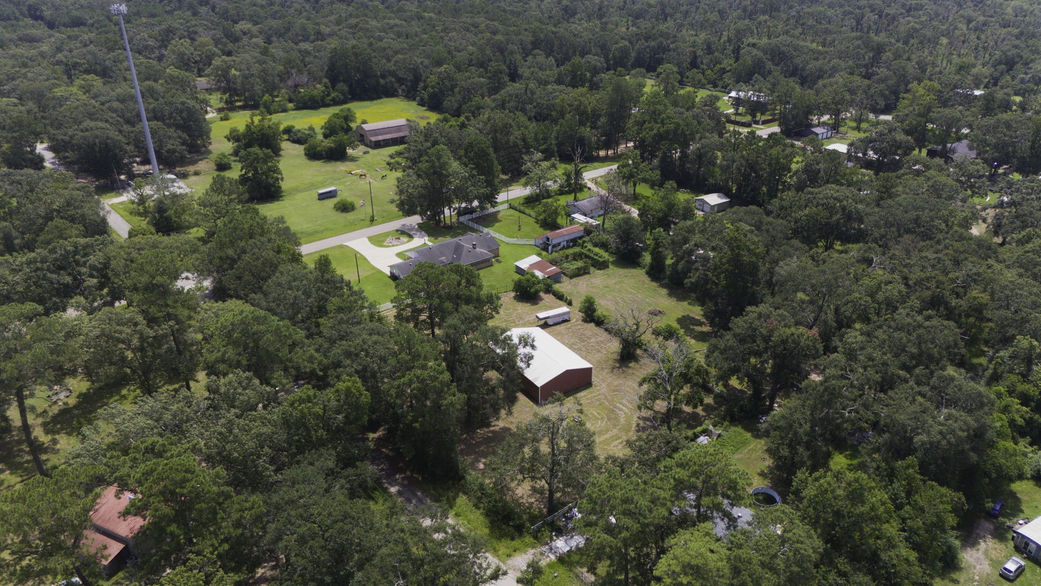 13180 Morgan Drive Splendora, TX 77372 - Photo 32 of 34 a bird view of building and green space