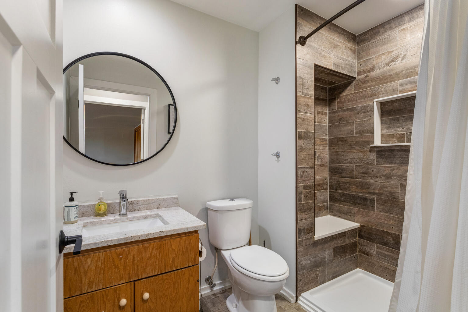 690 North Cove Court Decatur, IL 62521 - Photo 23 of 50 a bathroom with a toilet a sink and a mirror