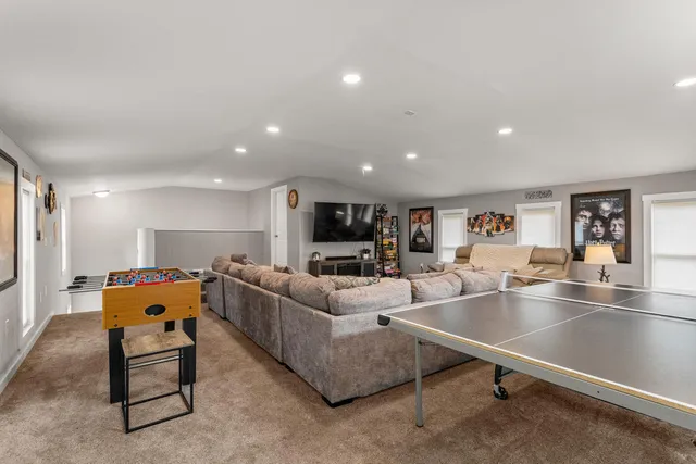 a large living room with furniture