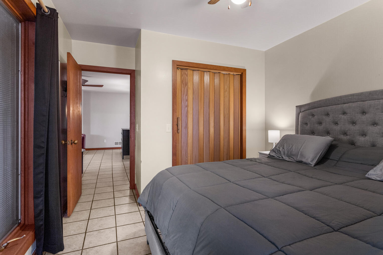 690 North Cove Court Decatur, IL 62521 - Photo 40 of 50 a bedroom with a bed and a lamp