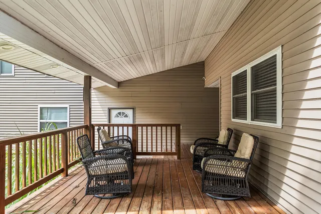 a view of a two chairs on the deck