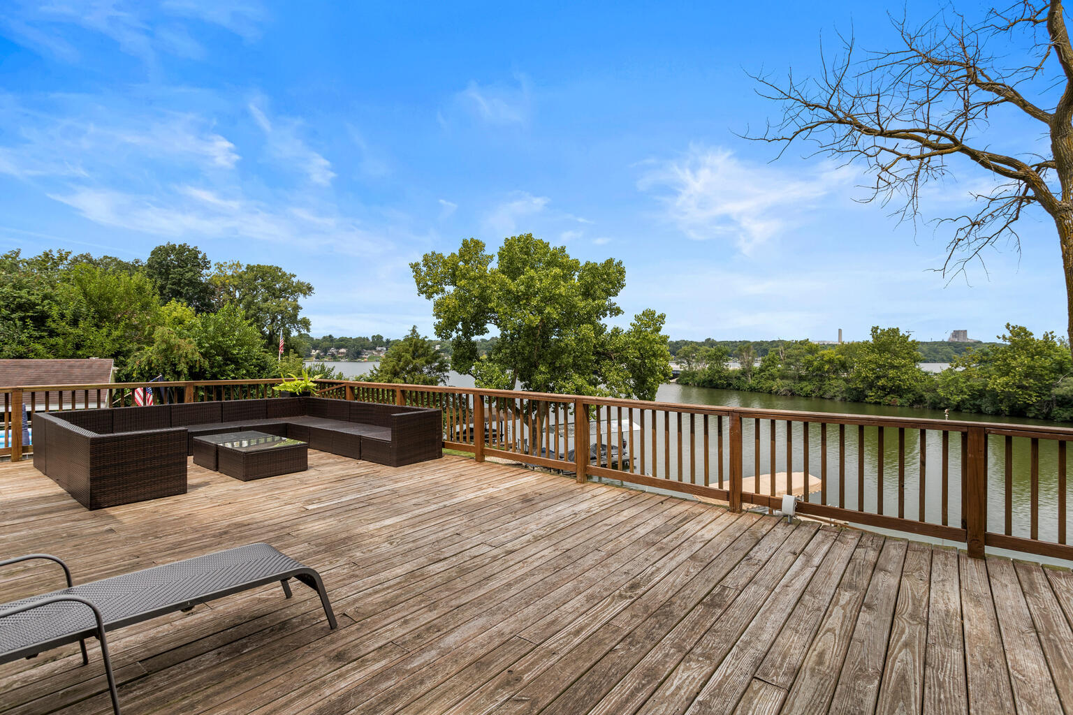 690 North Cove Court Decatur, IL 62521 - Photo 9 of 50 a view of a balcony with wooden floor and outdoor seating