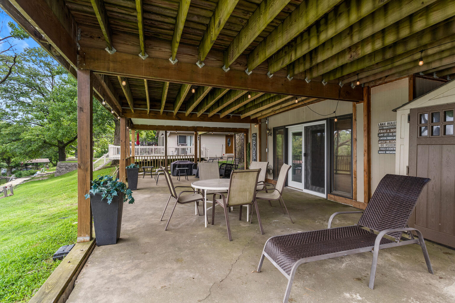 690 North Cove Court Decatur, IL 62521 - Photo 10 of 50 a view of a porch with chairs and backyard