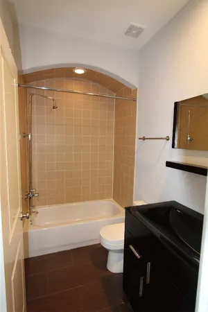 a bathroom with a bathtub and a shower