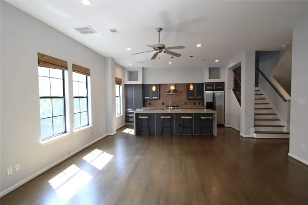 a view of kitchen and hall with wooden floor