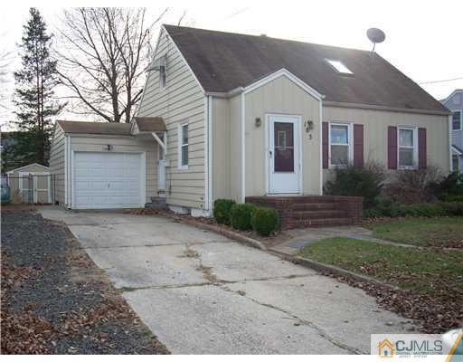 183 Old Post Road Edison, NJ 08817 - Photo 1 of 8 a front view of a house with a yard and garage