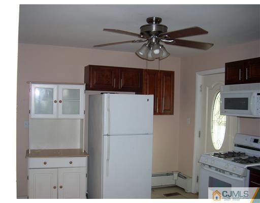 183 Old Post Road Edison, NJ 08817 - Photo 6 of 8 a kitchen with stainless steel appliances a refrigerator and a stove