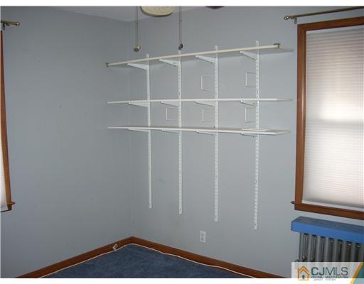 183 Old Post Road Edison, NJ 08817 - Photo 8 of 8 a view of a room with racks on the wall