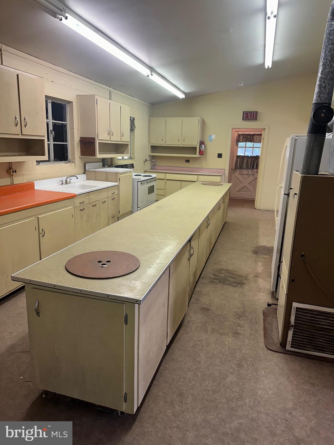 320 Locust Run Road Thompsontown, PA 17094 - Photo 11 of 29 a large kitchen with stainless steel appliances kitchen island granite countertop a sink a stove top oven a granite counter space and cabinets