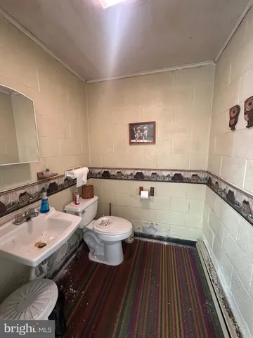 a bathroom with a sink and mirror