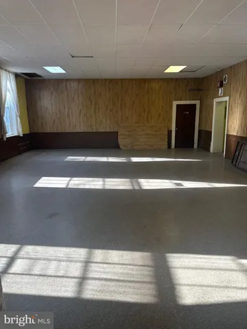 a view of walk in closet with empty room