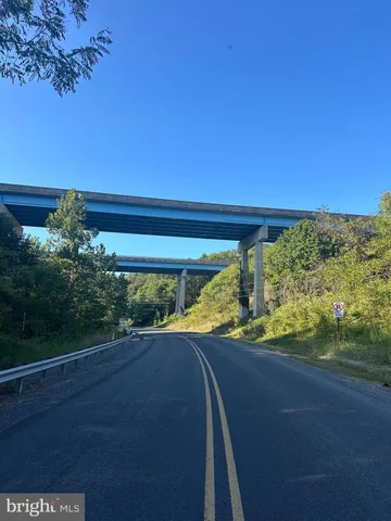 a view of swimming pool is middle in the middle of a yard