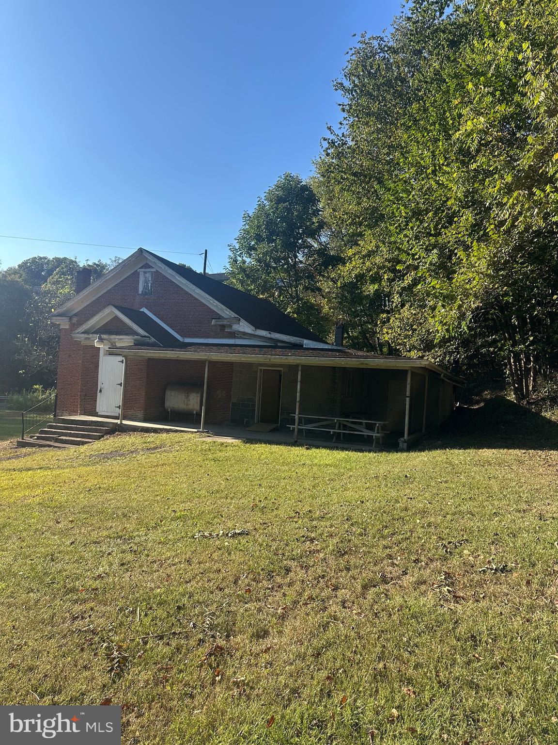 320 Locust Run Road Thompsontown, PA 17094 - Photo 3 of 29 a front view of house with yard and trees in the background