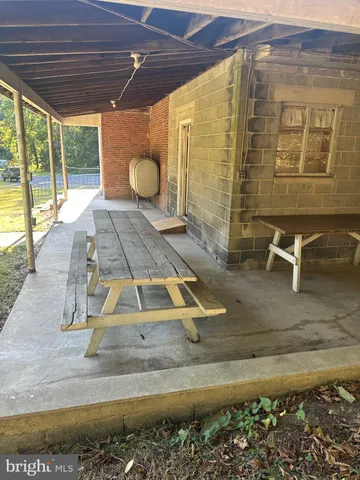 a view of swimming pool with outdoor seating