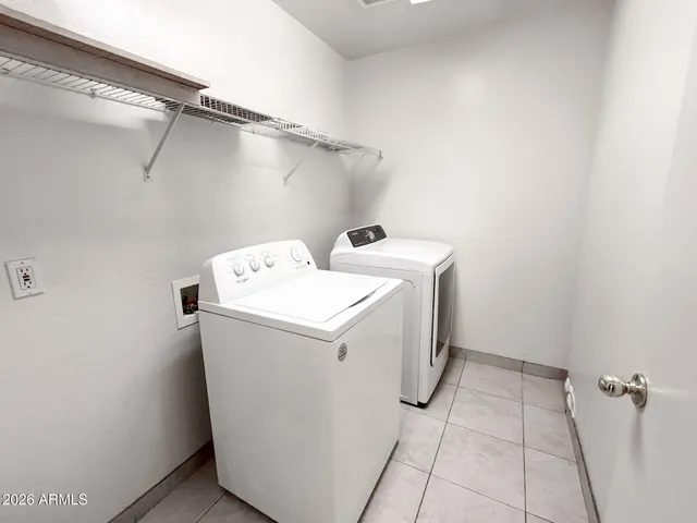 a view of staircase with white walls