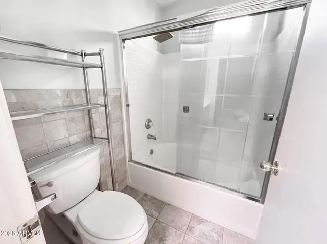 a view of a fence and trees