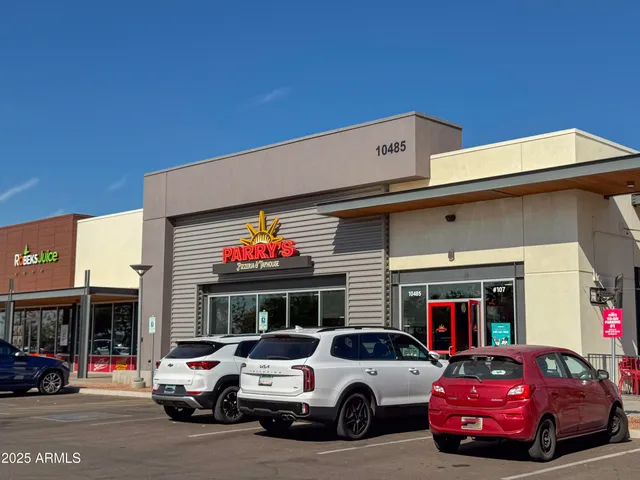 a view of a chairs and tables in patio