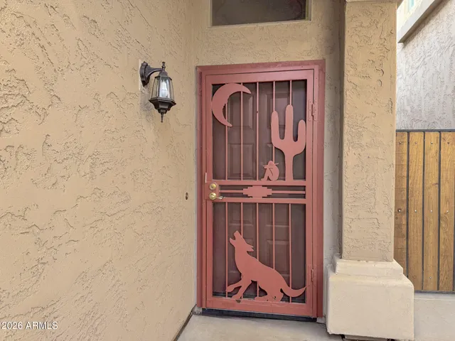 a view of front door with wooden floor