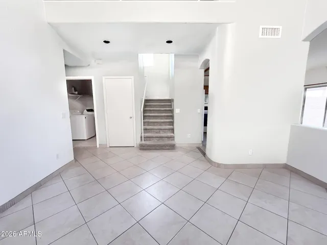 a kitchen with a stove a sink and a refrigerator