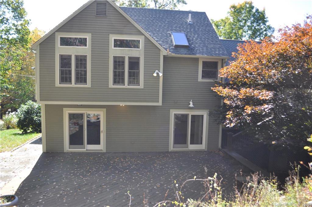 374 Park Road Waterbury, CT 06708 - Photo 1 of 1 a front view of a house with a yard and garage