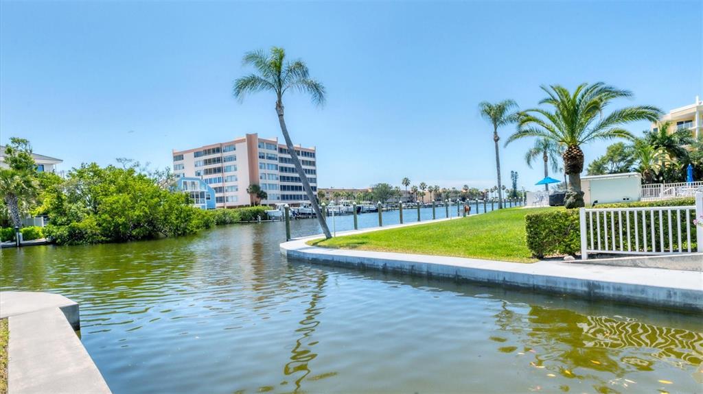 9200 Midnight Pass Road, Unit 24 Sarasota, FL 34242 - Photo 32 of 43 a view of a swimming pool with a terrace