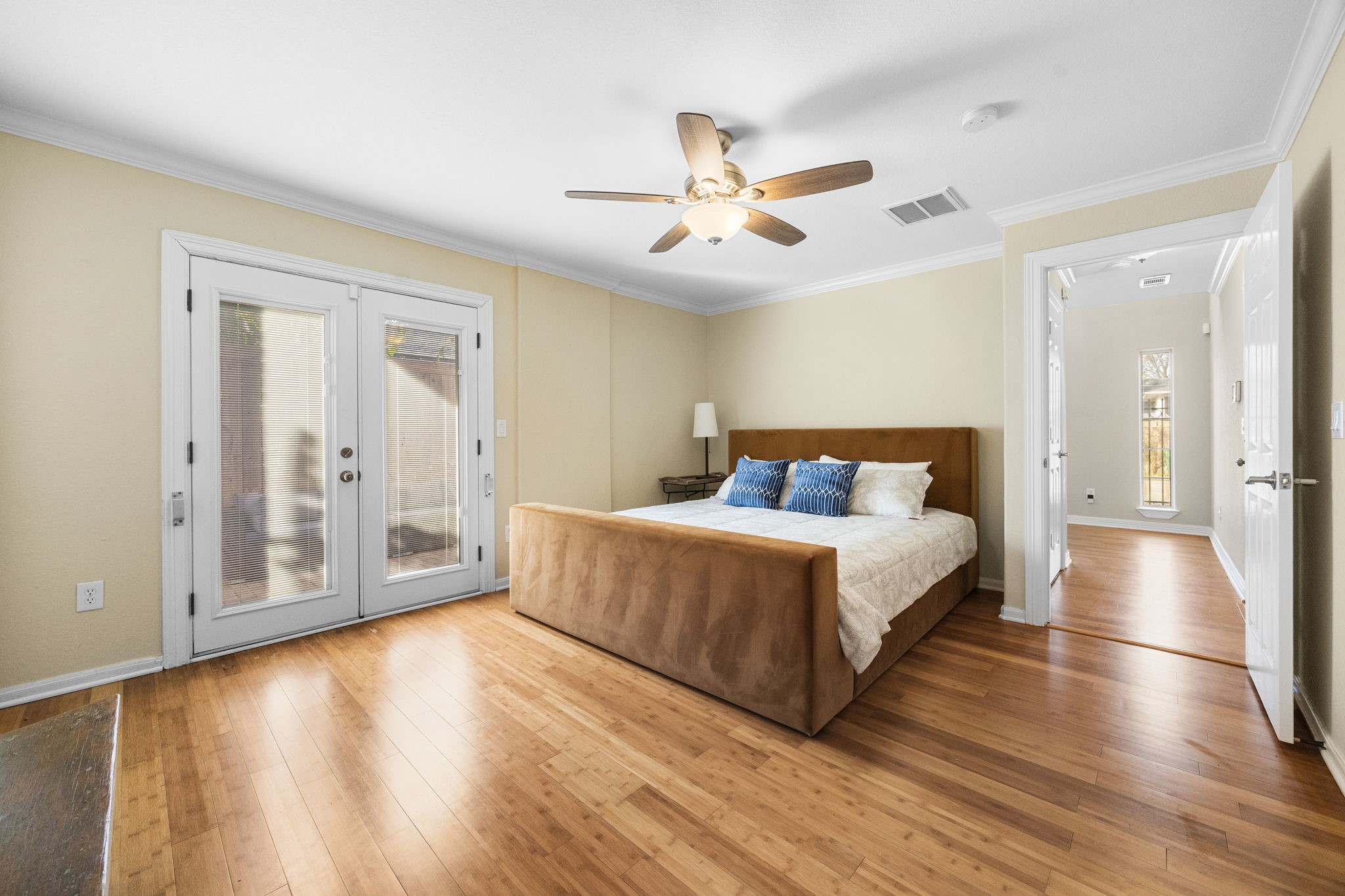 609 Gardner Street Houston, TX 77009 - Photo 25 of 32 a spacious bedroom with a bed and wooden floor
