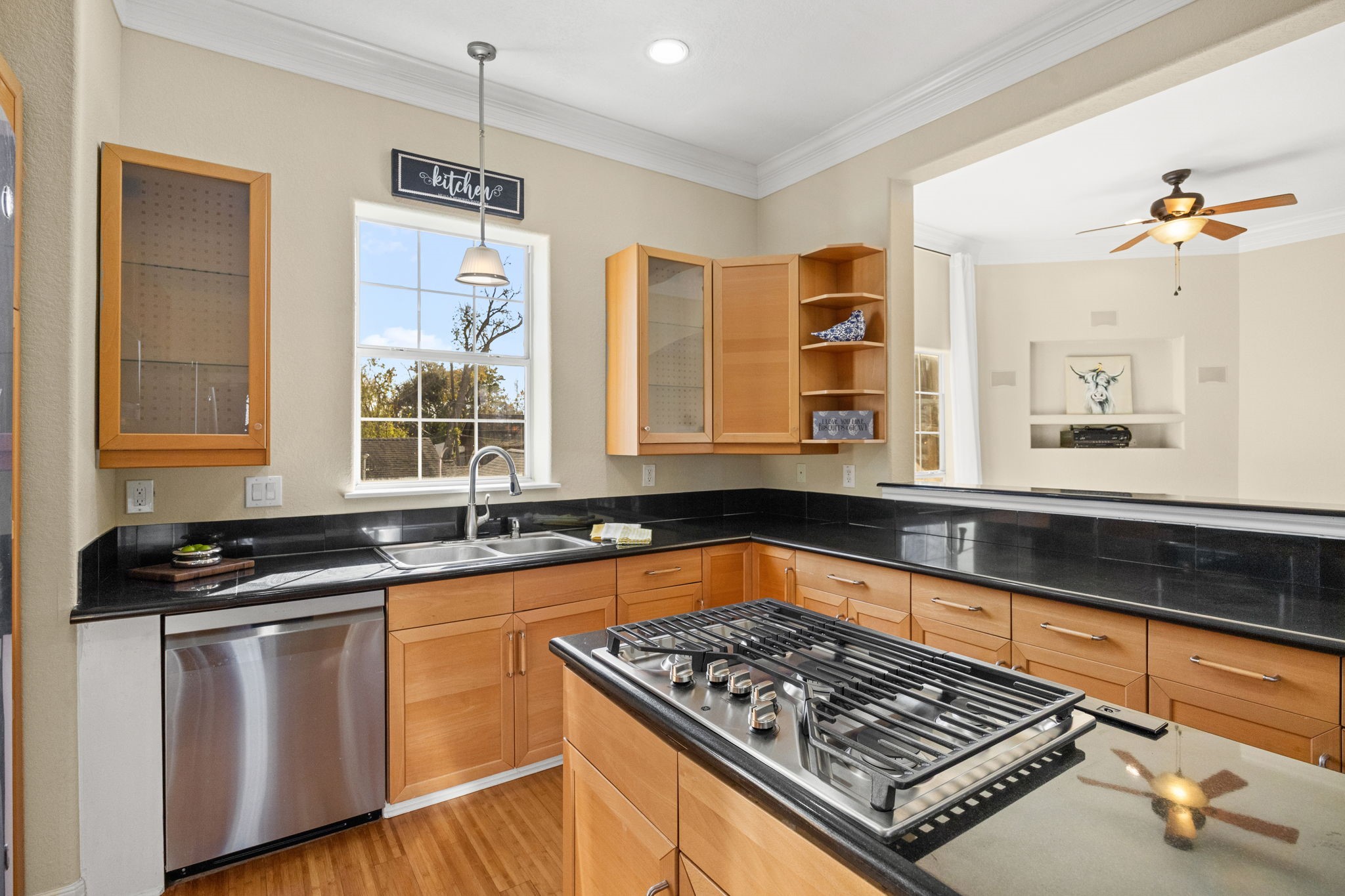 609 Gardner Street Houston, TX 77009 - Photo 9 of 32 a kitchen with granite countertop a stove and white cabinets