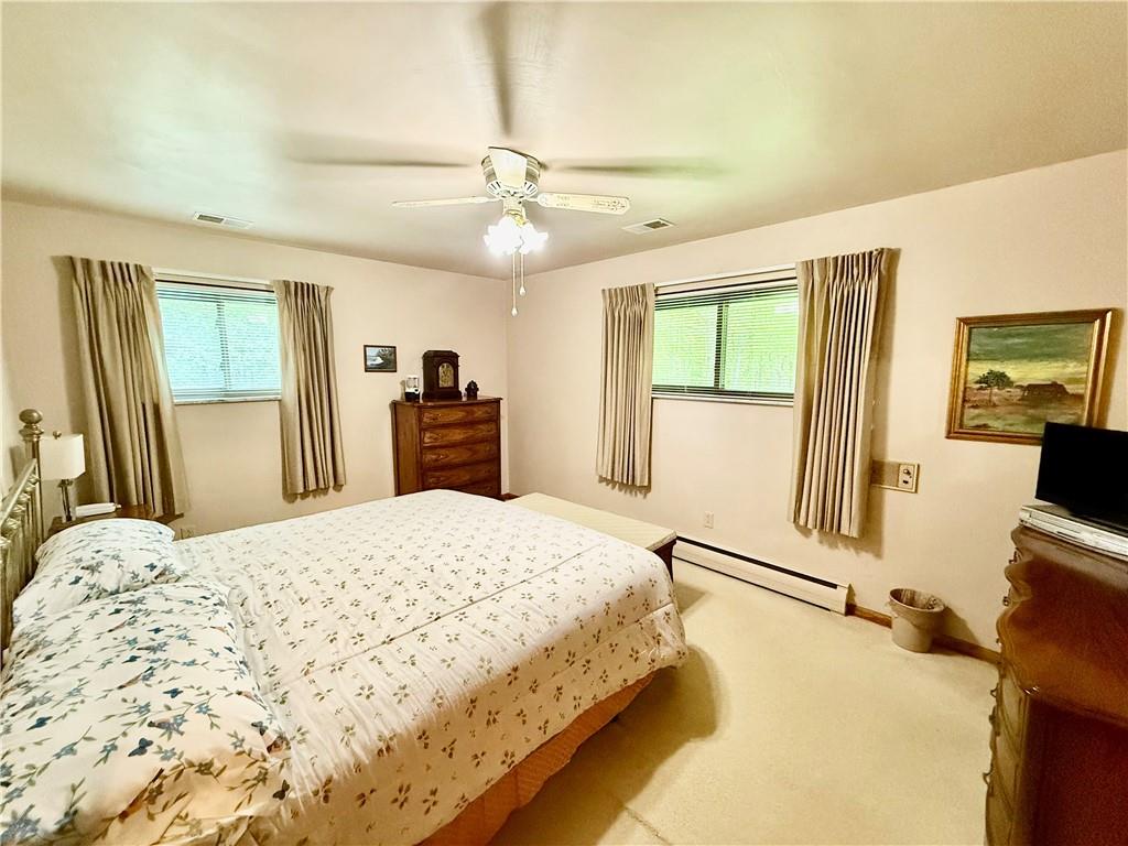 320 Saxonburg Road Butler, PA 16002 - Photo 21 of 36 a bedroom with a bed and wooden floor