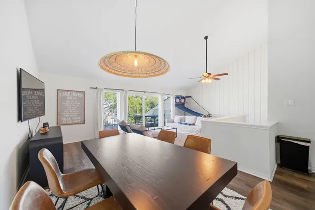 a spacious bedroom with a bed and a chandelier