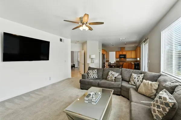 a kitchen with stainless steel appliances granite countertop sink stove top oven and refrigerator