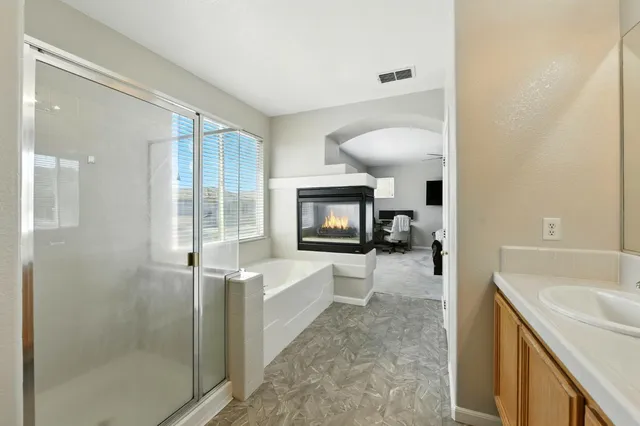 a bathroom with a sink toilet and mirror
