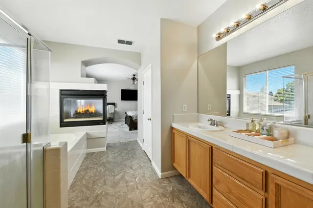 a bathroom with a sink double vanity and a mirror