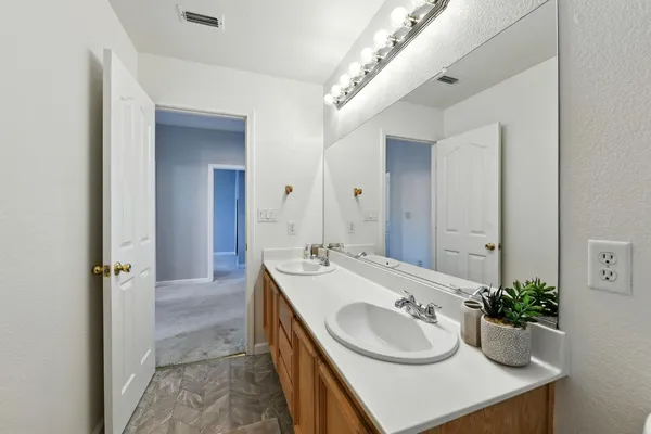 a view of a porch with furniture and a backyard